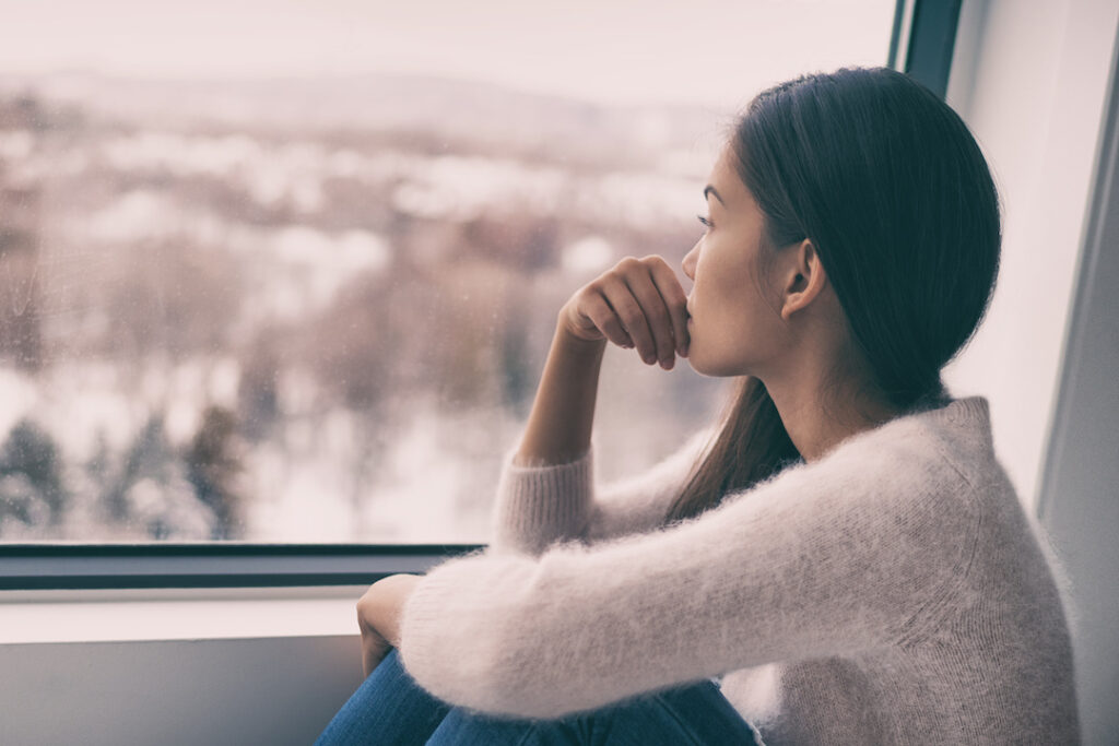 woman looking out of a window